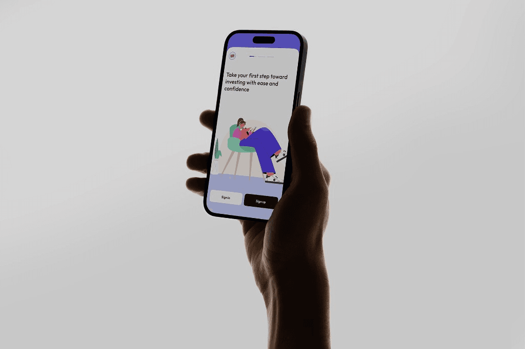 A hand holding a smartphone displaying the Dija onboarding screen: Take your first step toward investing with ease and confidence.